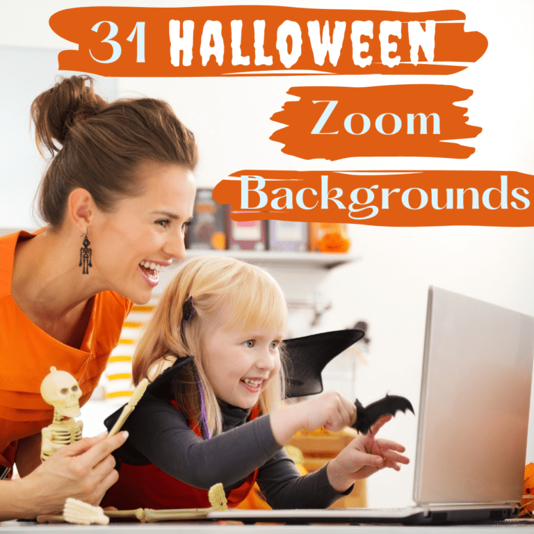 mom and young daughter holding halloween toys looking at laptop screen